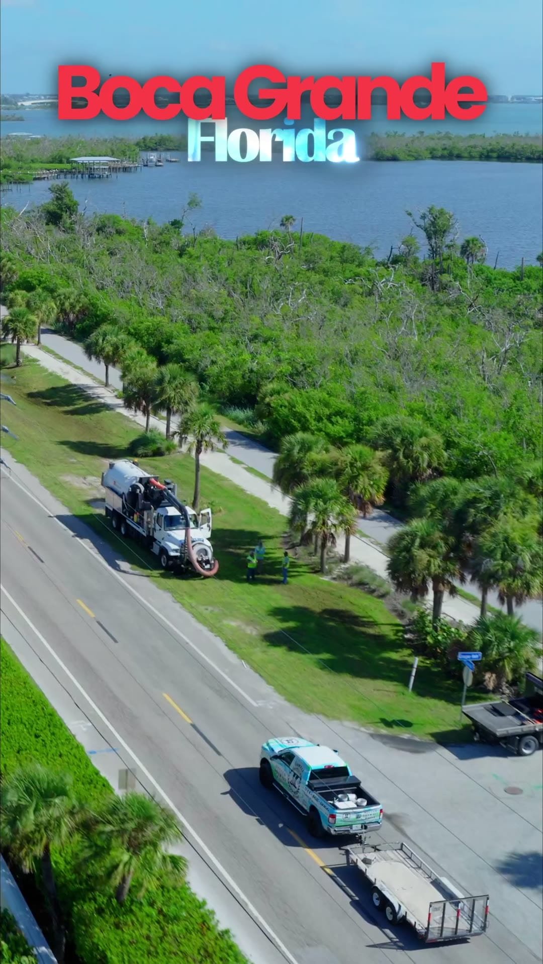 Aerial view over Boca Grande, Florida with a contractor vehicle on the coastal road