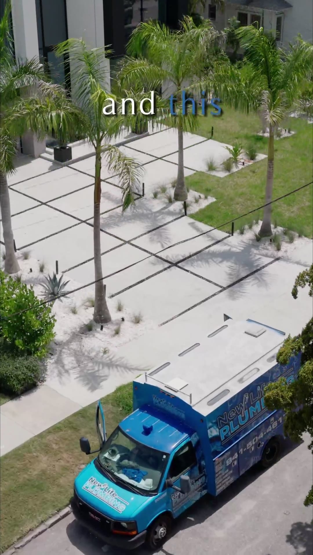 Aerial view of a modern Florida home with palms and a branded service truck on the driveway